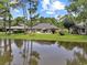 Stunning backyard view showcasing a deck overlooking a pond, with lush greenery and landscaping at 112 Birchwood Ln., Conway, SC 29526