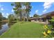 Serene backyard with a deck overlooking the pond at 112 Birchwood Ln., Conway, SC 29526