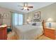 Comfortable bedroom with a ceiling fan, window, and traditional furnishings at 112 Birchwood Ln., Conway, SC 29526