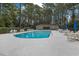 Enjoy the community pool, set amid the trees, with plenty of chairs and umbrellas for residents at 112 Birchwood Ln., Conway, SC 29526