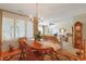Bright dining area with a large window, chandelier, and views of the living room at 112 Birchwood Ln., Conway, SC 29526