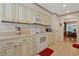 Charming kitchen featuring white appliances and cabinetry with neutral countertops at 112 Birchwood Ln., Conway, SC 29526