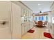 Cozy kitchen featuring white cabinetry, tile flooring, and an adjacent breakfast nook at 112 Birchwood Ln., Conway, SC 29526