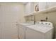 Functional laundry room with a washer, dryer, and shelving at 112 Birchwood Ln., Conway, SC 29526