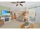 Open-concept living room with a fireplace and entertainment center, and adjacent dining area at 112 Birchwood Ln., Conway, SC 29526