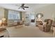 Comfortable living room with neutral decor, plush seating, and a ceiling fan at 112 Birchwood Ln., Conway, SC 29526