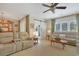 Spacious living area with ample seating, a barn door, and lots of natural light at 112 Birchwood Ln., Conway, SC 29526