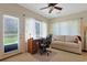 Bright office space with ample natural light, a desk, a couch, and backyard access at 112 Birchwood Ln., Conway, SC 29526
