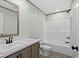 Well-lit bathroom featuring modern vanity, sleek fixtures, and a tub-shower combo at 1126 Amanda Lane, Loris, SC 29569