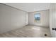 Bright, spacious bedroom featuring wood-look flooring, neutral walls, and large windows for ample natural light at 1126 Amanda Lane, Loris, SC 29569