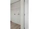 Bright laundry area with washer/dryer hookups and wire shelving for easy organization at 1126 Amanda Lane, Loris, SC 29569