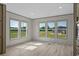 Bright living room featuring luxury vinyl plank flooring and views of the front yard at 1126 Amanda Lane, Loris, SC 29569