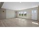 Spacious living room with large windows and modern flooring showcasing natural light at 1126 Amanda Lane, Loris, SC 29569