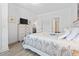 Bedroom featuring wood-look floors, a large bed and a television at 116 Kingsbury Loop # C, Conway, SC 29526