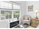 Cozy sitting area in the bedroom with a wicker chair and natural lighting at 116 Kingsbury Loop # C, Conway, SC 29526