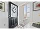 Interior view of the front door, highlighting a welcoming foyer and a glimpse of the home's interior at 116 Kingsbury Loop # C, Conway, SC 29526