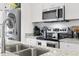 Well-equipped kitchen with stainless steel appliances and granite countertops, ideal for cooking and entertaining at 116 Kingsbury Loop # C, Conway, SC 29526