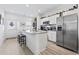 Bright and airy kitchen with stainless steel appliances, granite countertops, and a breakfast bar with seating at 116 Kingsbury Loop # C, Conway, SC 29526