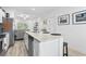 Open-concept kitchen with granite countertops, stainless steel appliances, and an island with seating at 116 Kingsbury Loop # C, Conway, SC 29526