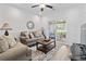 Comfortable living room with plush seating and sliding glass doors to the screened porch at 116 Kingsbury Loop # C, Conway, SC 29526