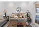 Inviting living room with plush seating, side tables, and decorative mirror at 116 Kingsbury Loop # C, Conway, SC 29526
