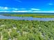 Stunning aerial view of a waterfront community, with beautiful homes nestled among lush greenery at 1176 Old Plantation Dr., Pawleys Island, SC 29585