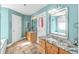 Bright primary bathroom with double vanity, granite countertops, and large framed mirror at 1176 Old Plantation Dr., Pawleys Island, SC 29585