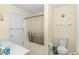 Cozy bathroom featuring a shower with curtain, toilet, and vanity with great lighting at 1176 Old Plantation Dr., Pawleys Island, SC 29585