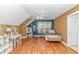 Charming bedroom with wood floors, a ceiling fan, and an open window with great sunlight at 1176 Old Plantation Dr., Pawleys Island, SC 29585