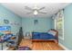 Relaxing bedroom with hardwood floors, ceiling fan, desk, and a comfortable bed setting at 1176 Old Plantation Dr., Pawleys Island, SC 29585