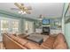 Cozy living room with a fireplace, built-in shelving, and French doors leading to the deck at 1176 Old Plantation Dr., Pawleys Island, SC 29585
