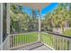 Outdoor screened porch boasting scenic views of lush trees and lawn at 1176 Old Plantation Dr., Pawleys Island, SC 29585