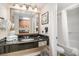 Elegant bathroom with granite vanity, well-lit mirror, and walk-in shower, offering a spa-like experience at 1200 N Ocean Blvd. # 211, Myrtle Beach, SC 29577