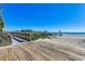 Beach boardwalk with access to a sandy beach and view of the ocean and pier at 1200 N Ocean Blvd. # 211, Myrtle Beach, SC 29577