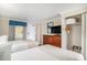 Well-appointed bedroom with two beds, dresser and TV, closet space, perfect for relaxation and entertainment at 1200 N Ocean Blvd. # 211, Myrtle Beach, SC 29577