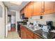 Galley kitchen design with granite countertops and views to the bedroom at 1200 N Ocean Blvd. # 211, Myrtle Beach, SC 29577