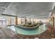 Indoor lazy river showcasing a stone-tiled border, 3ft depth marking and decorative plants at 1200 N Ocean Blvd. # 211, Myrtle Beach, SC 29577