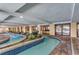 Indoor lazy river featuring brick accents, decorative plants, and a tile water line at 1200 N Ocean Blvd. # 211, Myrtle Beach, SC 29577