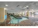 Indoor lazy river with brick accents, lounge chairs and decorative plants at 1200 N Ocean Blvd. # 211, Myrtle Beach, SC 29577