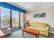 Comfortable living room with a sliding glass door to balcony and a loveseat at 1200 N Ocean Blvd. # 211, Myrtle Beach, SC 29577