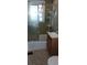 The small bathroom includes a shower with sliding glass doors at 1206 French Rd, Mullins, SC 29574