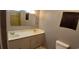 A traditional bathroom features a double vanity and a separate toilet at 1206 French Rd, Mullins, SC 29574