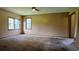 The bright bedroom has two windows and wall-to-wall carpet at 1206 French Rd, Mullins, SC 29574