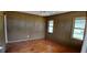 Bedroom with wood floors, neutral walls, ceiling fan, and bright natural light at 1206 French Rd, Mullins, SC 29574