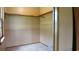 This carpeted closet includes a rail for hanging clothes at 1206 French Rd, Mullins, SC 29574