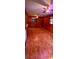 Spacious living room featuring wood paneling and original hardwood floors at 1206 French Rd, Mullins, SC 29574