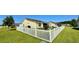 Landscaped backyard featuring a white picket fence and mature trees; perfect for outdoor entertaining at 1300 Ruddy Ct., Conway, SC 29527