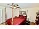 Bedroom features a four-poster bed, ceiling fan, and stylish decor at 1300 Ruddy Ct., Conway, SC 29527