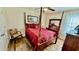 Cozy bedroom boasts a four-poster bed, ceiling fan, and elegant furnishings at 1300 Ruddy Ct., Conway, SC 29527