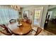 Bright dining room featuring a classic chandelier and easy access to the outdoor patio at 1300 Ruddy Ct., Conway, SC 29527